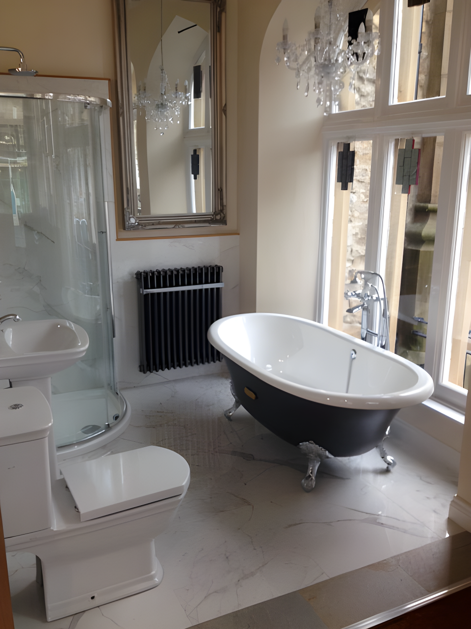 Modern bathroom with black freestanding bathtub, curved shower enclosure, white toilet, and black radiator