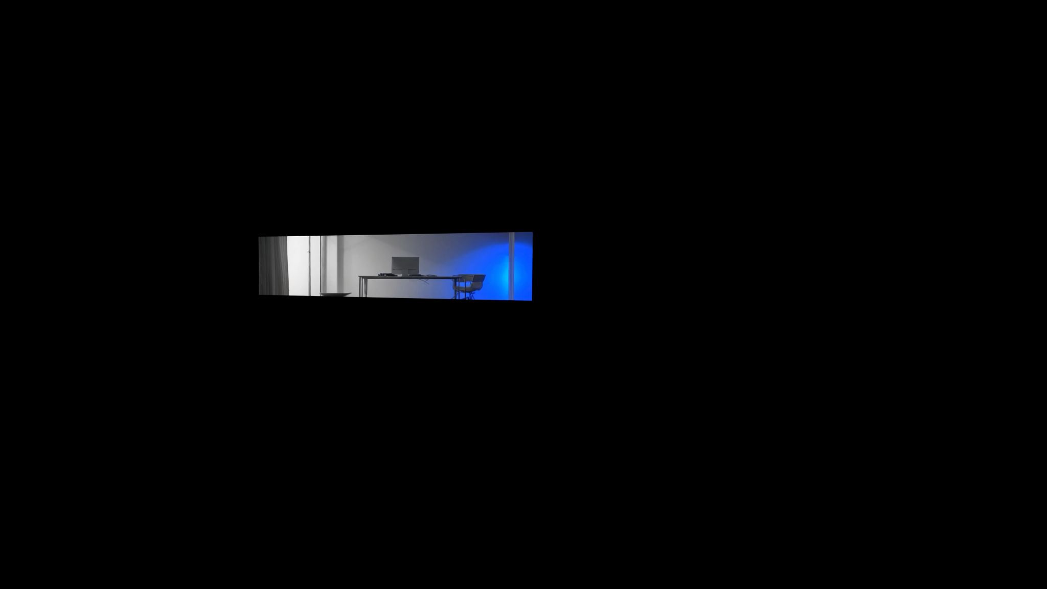 Modern workspace with minimalist desk setup and glowing blue accent lighting